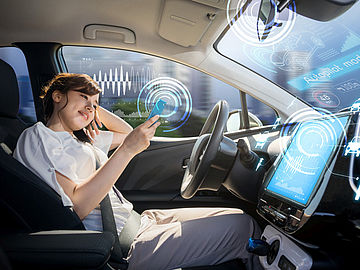 woman sitting in a selfdriving car
