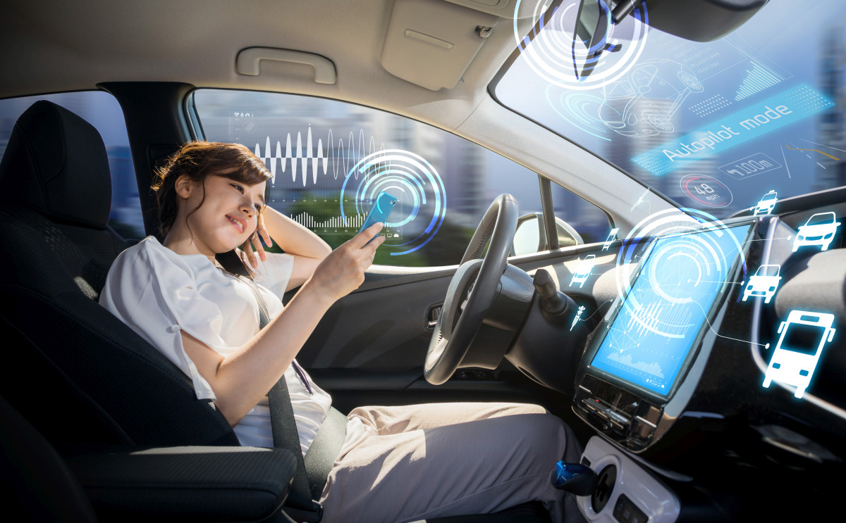 woman sitting in a selfdriving car