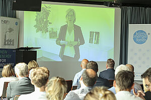 Photo: Leonore Gewessler (BMK) speaks to the audience via video message
