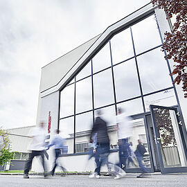 front view of a building and people